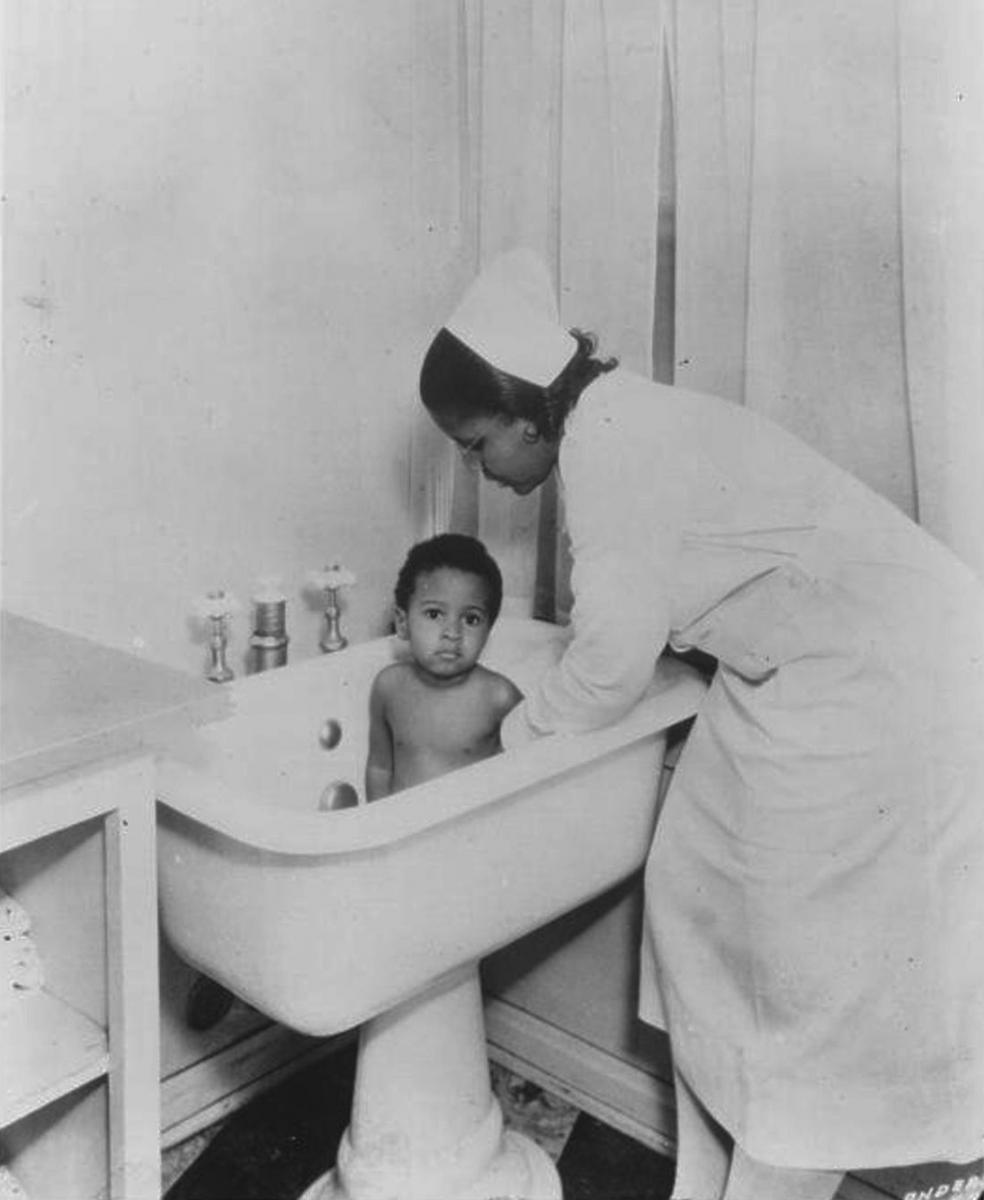 Bathing a child at the Florence Home